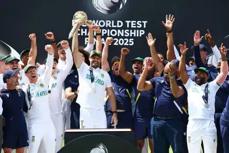 Markram lifts mace in celebration as South African teammates cheer at Lord’s.